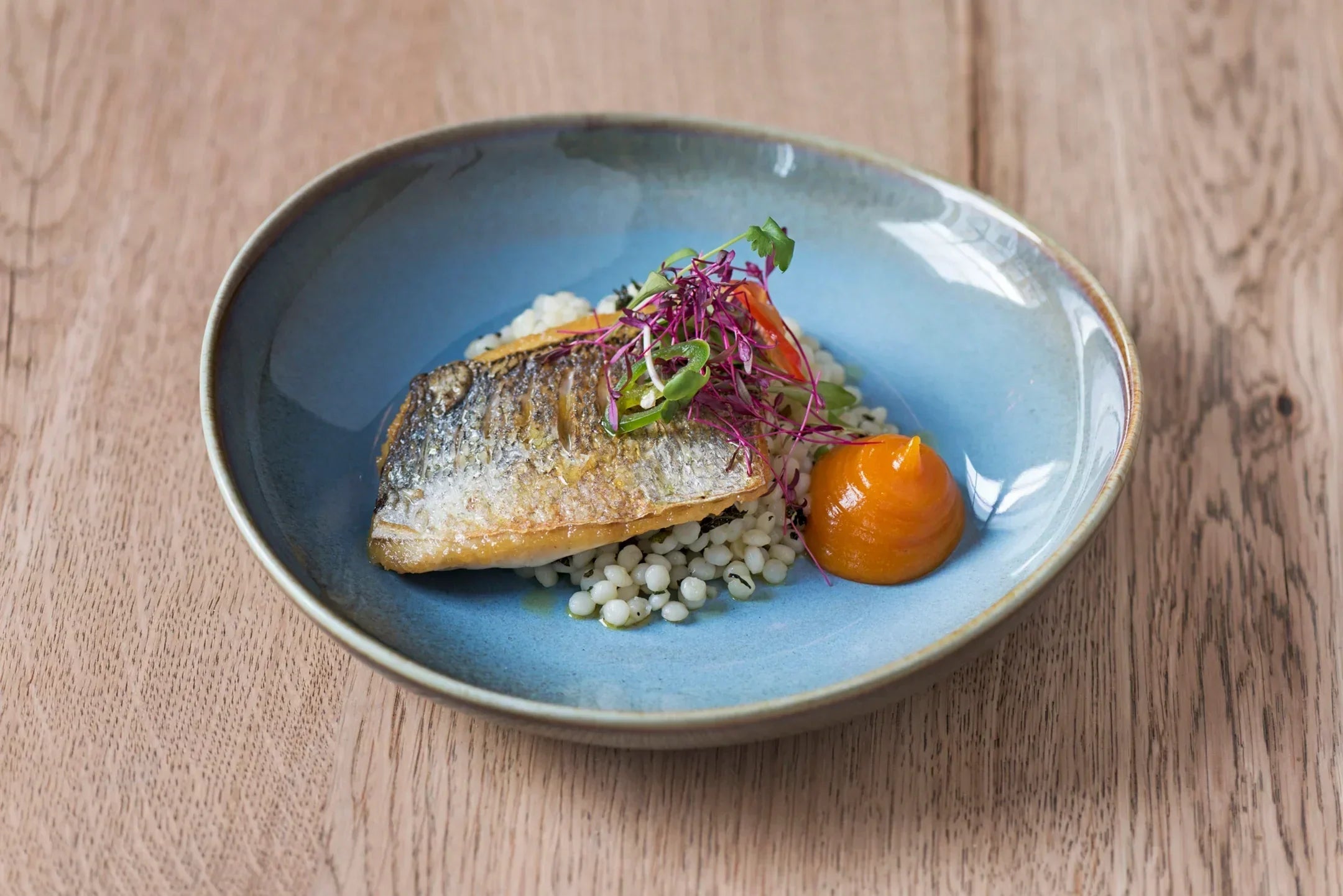 Pan fried sea bass with pearl barley